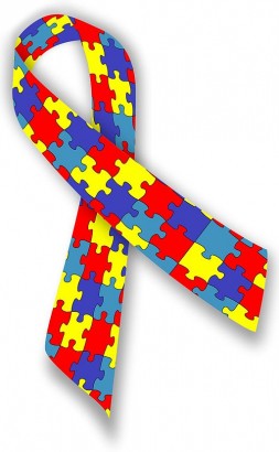 Az autista személyek mellett való kiállás jelképe: puzzle mintás szalag 